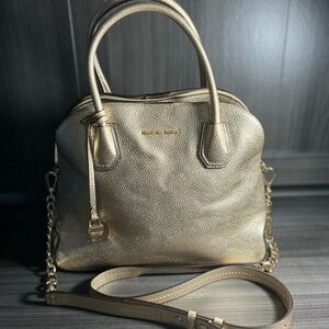 The Michael Kors Mercer Metallic Gold Leather Dome Satchel Shoulder Bag M K